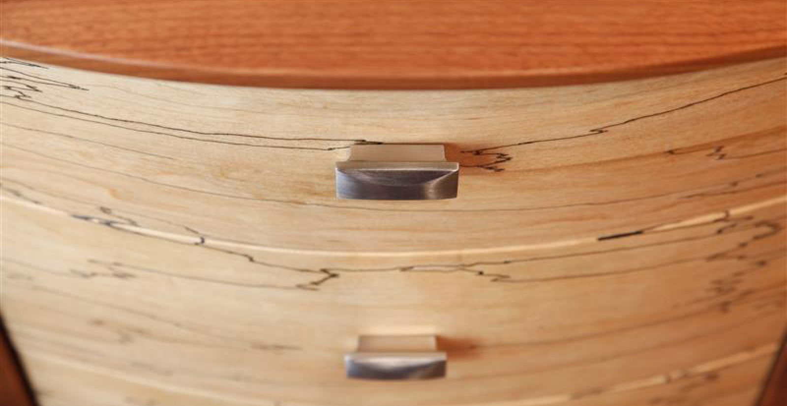 close up of a mixed wood dresser
