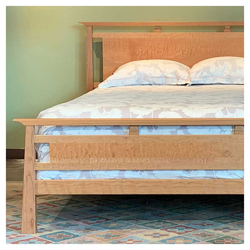 queen mendon bed in solid cherry with quilted maple panel