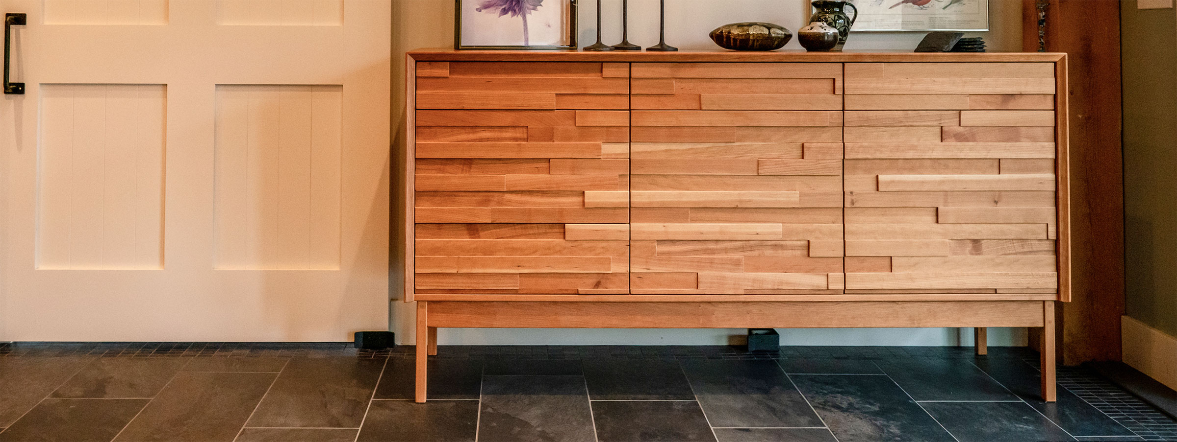 cherry storage cabinet in entry way