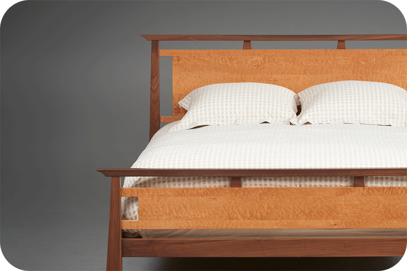 close up of bed with two colors of wood
