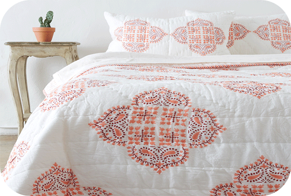 white and coral quilt