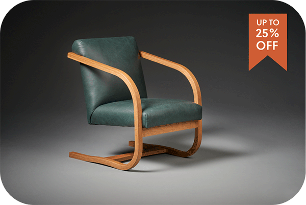 modern chair with wood frame and green leather
