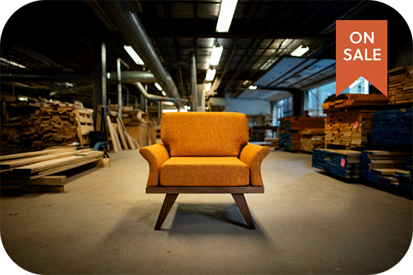 modern orange chair in a woodshop