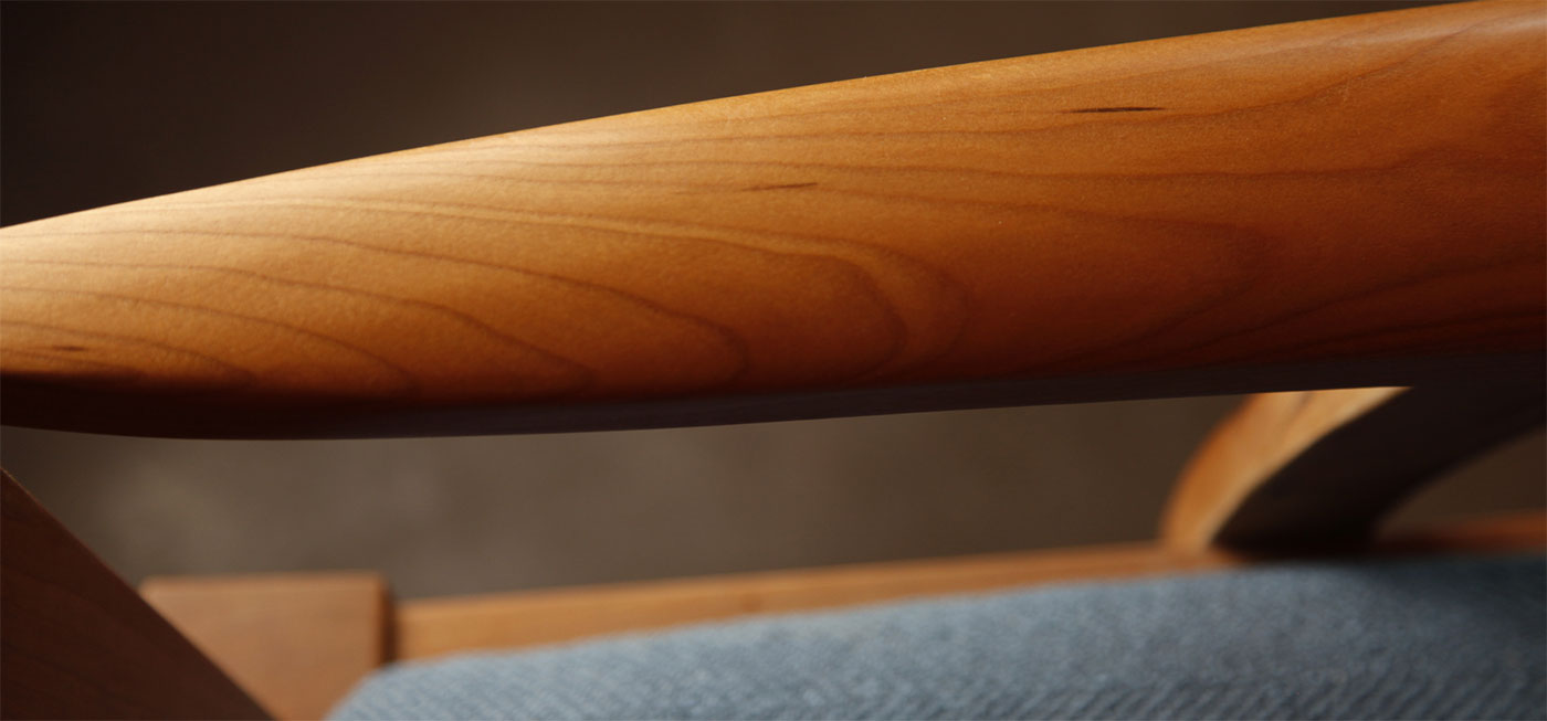close up of cherry chair arm